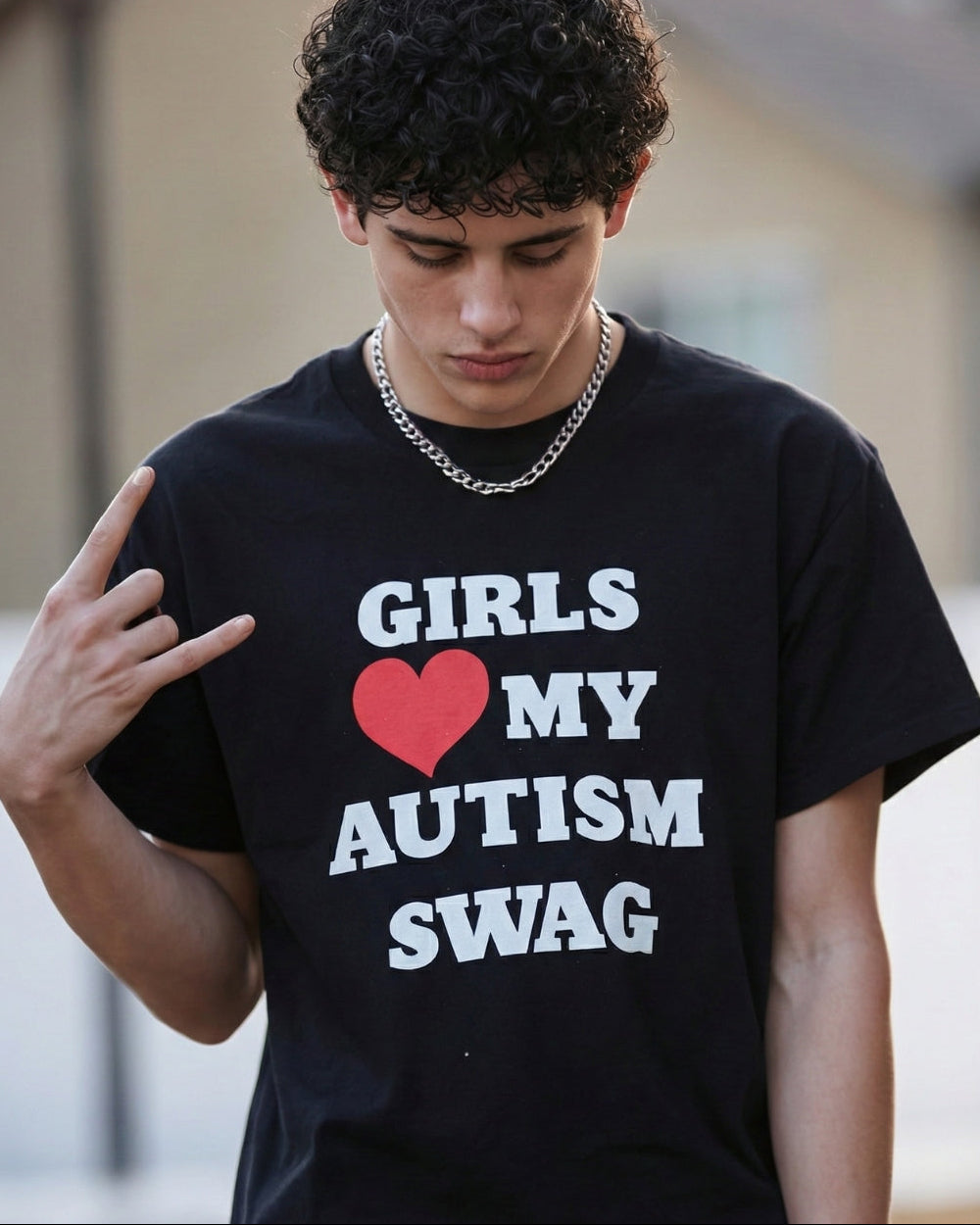 Person wearing a black t-shirt with 'Girls love my swag' text and heart symbol.